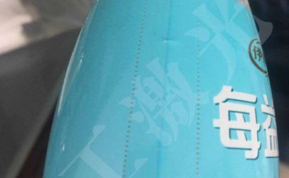 武汉三工激光打标机在果汁饮料热封标签上的多功能应用